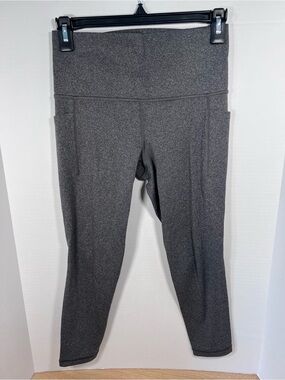 Athleta Salutation 7/8 stash pocket tights gray size Small